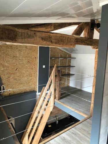 En eller flere køjesenge i et værelse på Maison Loft Saint-Dizier