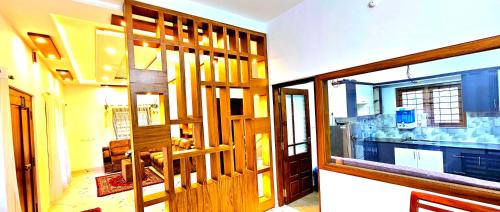 a view of a room with a wooden door at Dean Dale Cottages in Thekkady