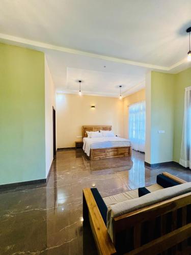 a large bedroom with a bed in a room at Sound Sleep Resort in Arugam Bay