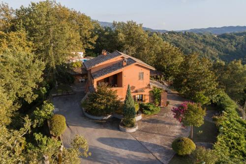 an aerial view of a house with trees at Il Borgo nel bosco in Canterano