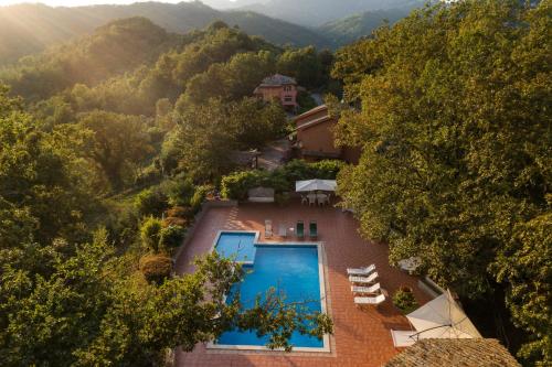an aerial view of a house with a swimming pool at Il Borgo nel bosco in Canterano