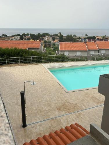 a large swimming pool on top of a building at Appartamento Il Tramonto in Castelsardo