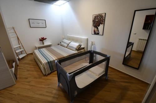 a small room with a bed and a mirror at Dream House in Piazza Armerina