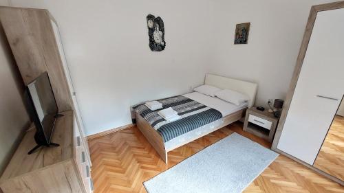 Postel nebo postele na pokoji v ubytování Apartman Perun - Niksic