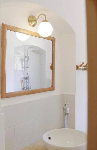 a bathroom with a white sink and a mirror at Aqua Sun in Nuweiba