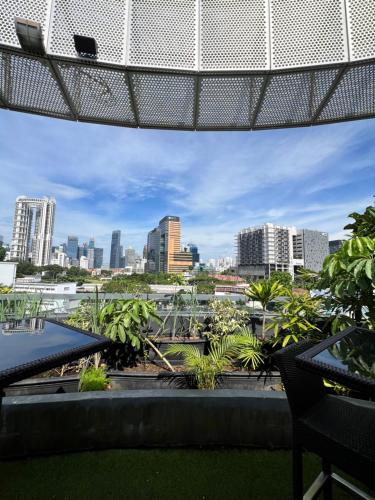 a view of the city from the roof of a building at D'Hotel Singapore managed by The Ascott Limited in Singapore
