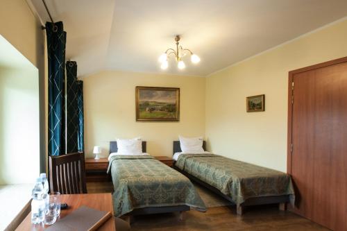 Postel nebo postele na pokoji v ubytování HOTEL I RESTAURACJA BROCHÓW