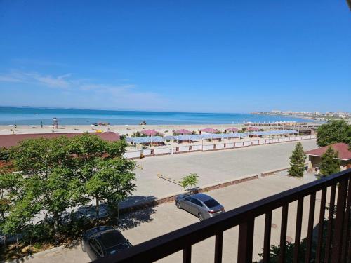a view of a beach with cars parked in a parking lot at Guest House Dostar - Жағажай Үй Достар in Aktau
