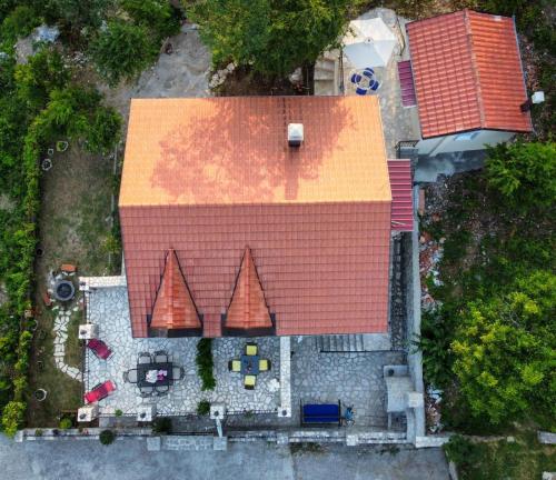 an overhead view of a house with a red roof at Villagio in Virpazar