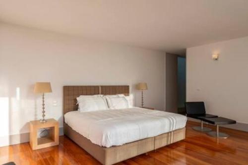 Ένα ή περισσότερα κρεβάτια σε δωμάτιο στο Pirilampo