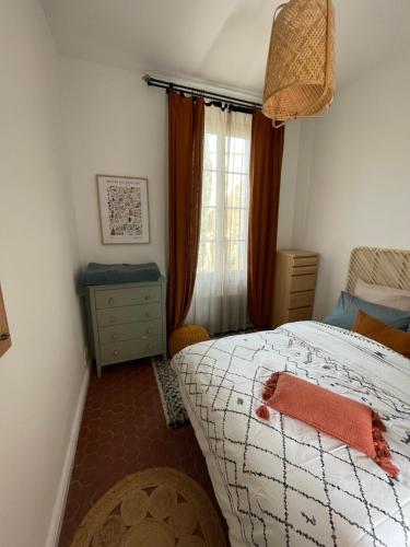 Postel nebo postele na pokoji v ubytování La maison du Dragon