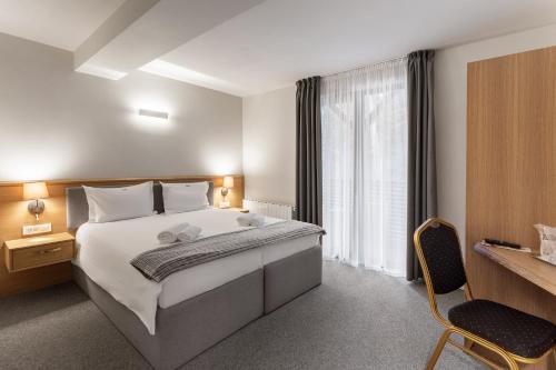 Кровать или кровати в номере Eden Grand Resort
