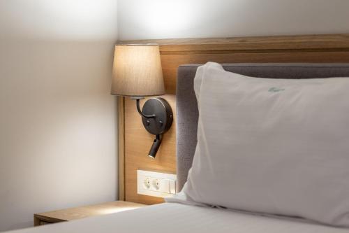 Кровать или кровати в номере Eden Grand Resort