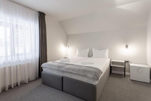 Кровать или кровати в номере Eden Grand Resort