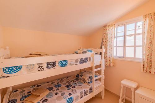 Ένα ή περισσότερα κρεβάτια σε δωμάτιο στο Penthouse Apt With Jacuzzi By Dream Homes Tenerife