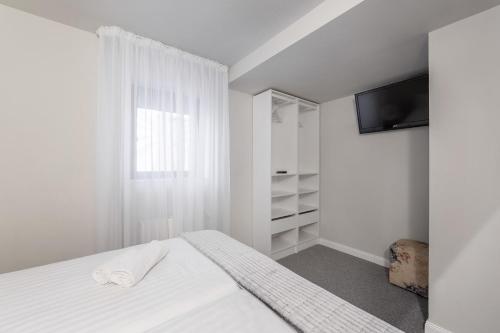 Кровать или кровати в номере Eden Grand Resort