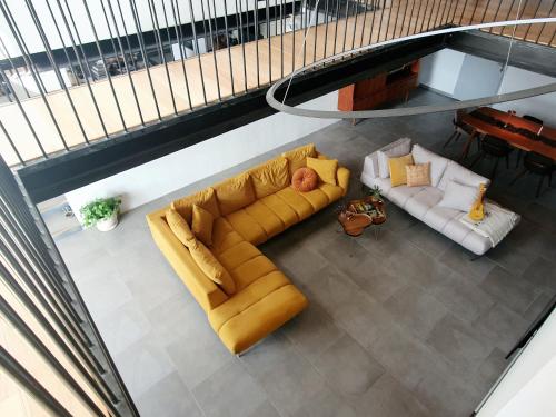 a living room with a couch and two chairs at La ferme - Domaine Monbel in Mirepoix