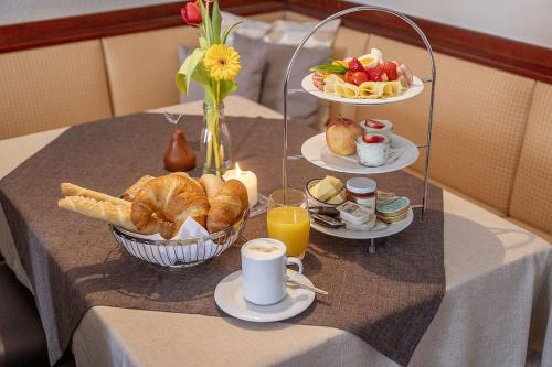 a table with a tray of breakfast foods and drinks at Wallseerhof in Wallsee