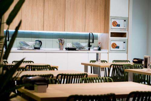 a restaurant with tables and chairs and a counter at Futurotel Sevilla in Seville