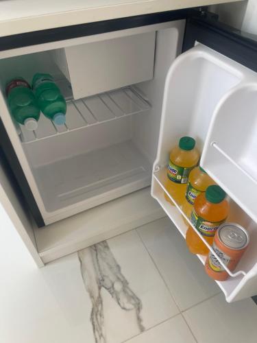 an open refrigerator filled with lots of food and drinks at Terrazza Belvedere in Ercolano