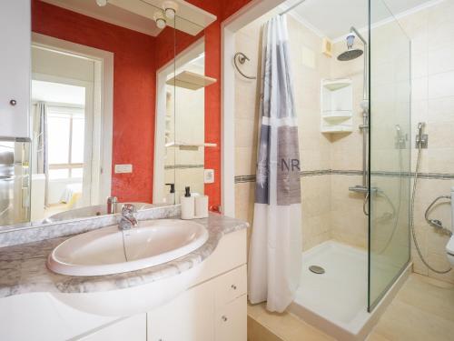 a bathroom with a sink and a shower at Amanecer Playa Patalavaca in Patalavaca