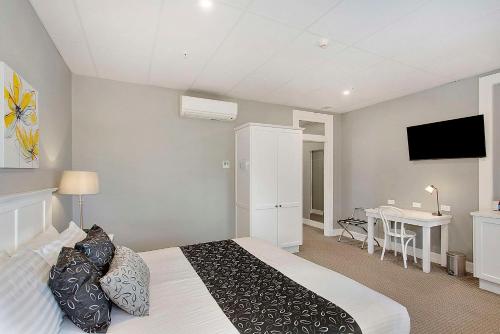 CH Boutique Hotel & Apartments, an Ascend Collection Hotelにあるテレビまたはエンターテインメントセンター