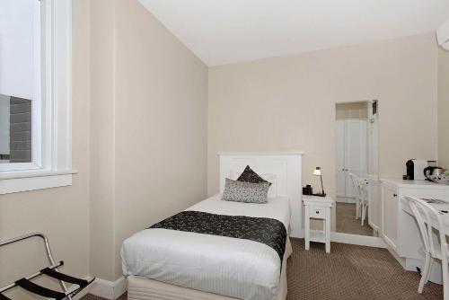 CH Boutique Hotel & Apartments, an Ascend Collection Hotelにあるベッド