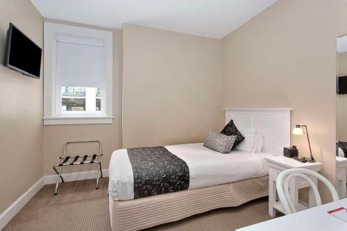 CH Boutique Hotel & Apartments, an Ascend Collection Hotelにあるベッド