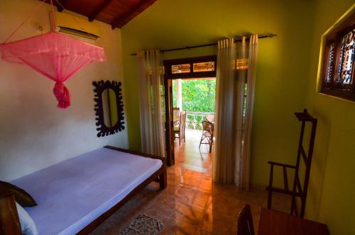 Postel nebo postele na pokoji v ubytování Binara Home Stay