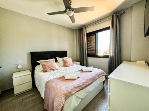 a bedroom with a bed with two towels on it at Mandarina 326 in San Miguel de Abona