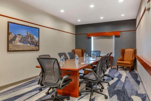 a conference room with a long table and chairs at Comfort Inn & Suites Rapid City near Mt Rushmore in Rapid City