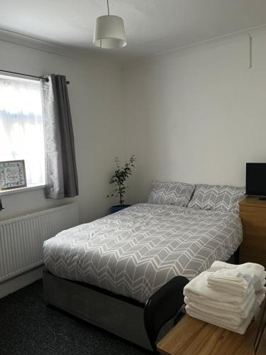 Postel nebo postele na pokoji v ubytování Phoenix House