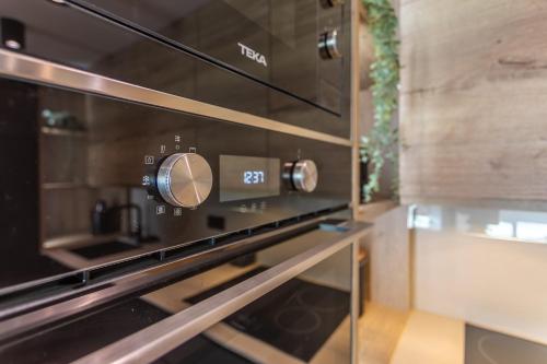 a microwave oven sitting on top of a counter at Terrace, sea view, pool, parking space & fibre in Tarifa