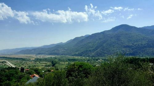 a view of a valley with mountains in the background at Mountaintop hostel apartments - Hostel Kvish^Khedi in K'vishkhet'i