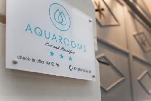 a sign for a aquariums aquarium brinks on a building at AQUAROOMS Suites in Palermo