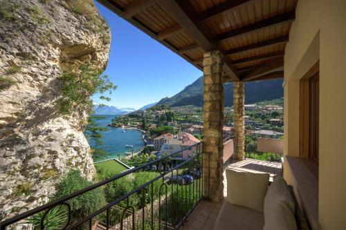 a balcony of a house with a view of the water at Breathtaking view. in Malcesine