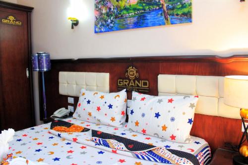 a bedroom with a bed with stars on it at Grand Hotel Ras Elbar in Ras El Bar