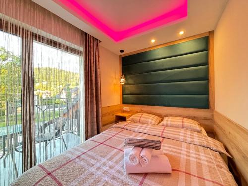 Postel nebo postele na pokoji v ubytování ASENATA Ustroń Centrum