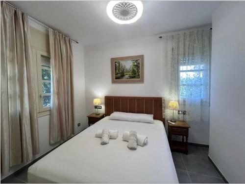 Ένα ή περισσότερα κρεβάτια σε δωμάτιο στο ARENDA Pino Alto Villa Napoleon