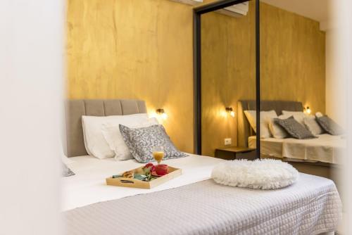 a bedroom with a bed with a tray of fruit on it at Zvonimir Holiday with large 95m2 pool in Solin