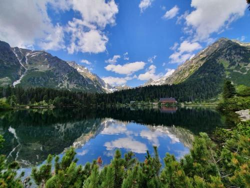 a view of a lake with mountains in the background at Apartmán ve Vysokých Tatrách in Štrbské Pleso
