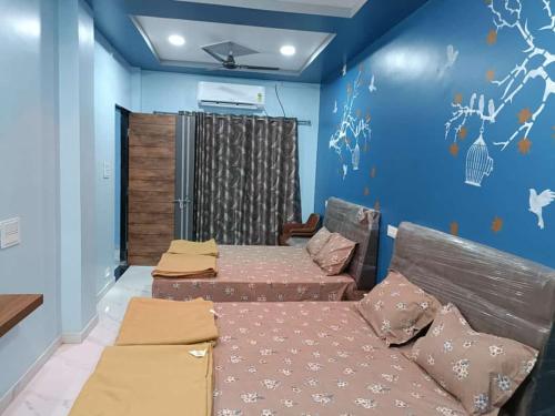 Postel nebo postele na pokoji v ubytování Atithi home stay