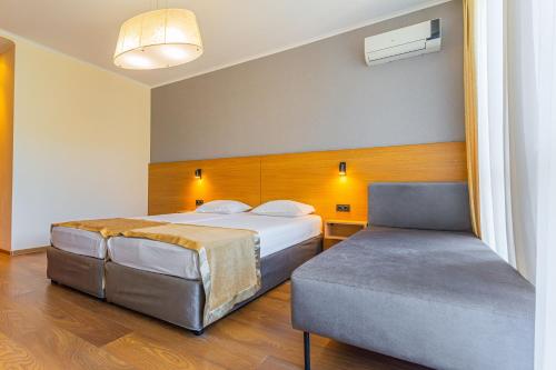 Postel nebo postele na pokoji v ubytování Apart Hotel Golden Line