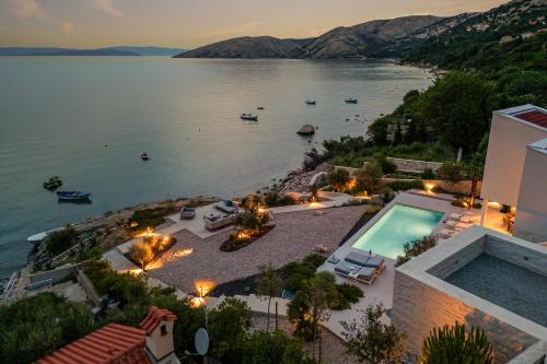 an aerial view of a villa with a view of a lake at Luxusvilla Marim in Stara Baška