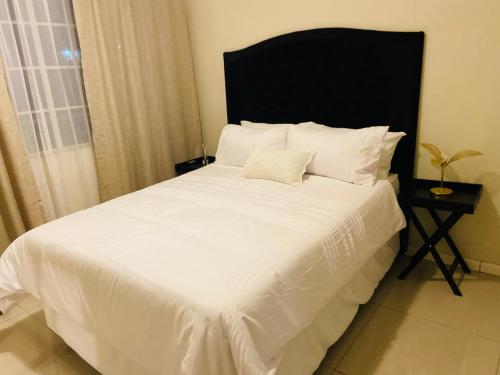 Postel nebo postele na pokoji v ubytování SinoT Short Stays