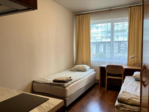 Postel nebo postele na pokoji v ubytování RVR Smart Apartments Riga with self Check-in
