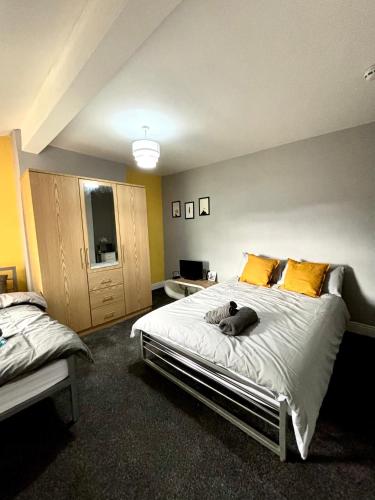 a bedroom with a dog laying on a bed at CROFT House in Manchester