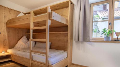 a bunk bed in a tiny house at Ferienwohnung Zweite Heimat in Mieders
