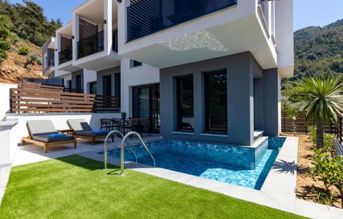 an image of a house with a swimming pool at Pearl of Thassos in Skala Potamias