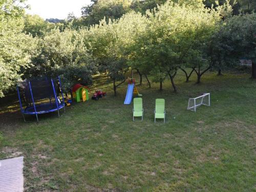 an aerial view of a park with a playground and chairs at Kuća za odmor Stara Jabuka in Ledinci